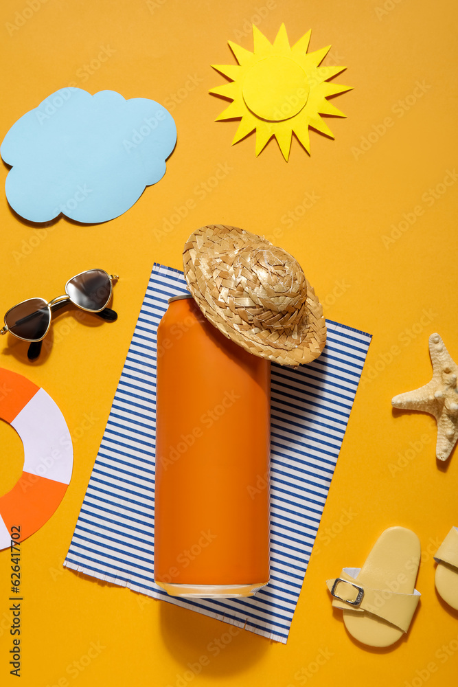 Can of soda with beach decor on orange background