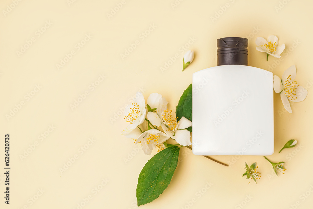 Bottle of cosmetic product and beautiful jasmine flowers on color background