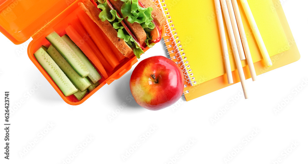 Stationery and lunchbox with yummy food isolated on white background