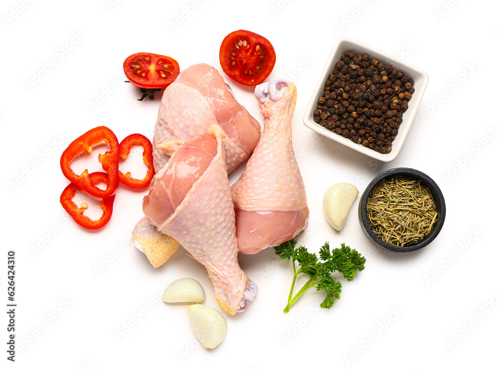 Composition with raw chicken legs and fresh spices on white background