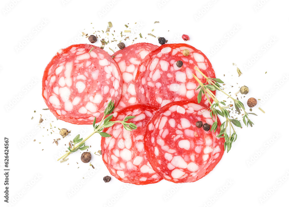 Slices of tasty salami with spices on white background