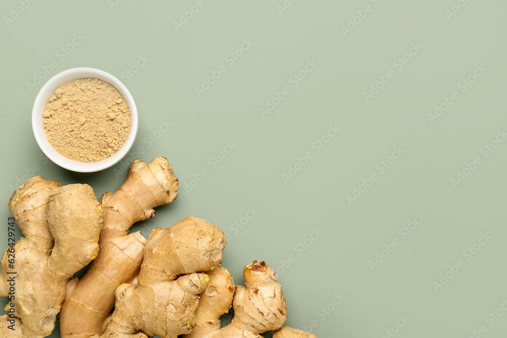 Fresh ginger roots and bowl with dried powder on grey background