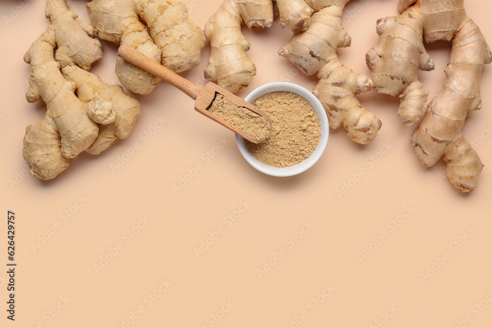 Fresh ginger roots, bowl and wooden scoop with dried powder on orange background