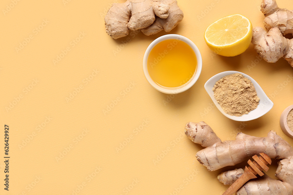 Fresh ginger roots, lemon and bowl with dried powder on yellow background