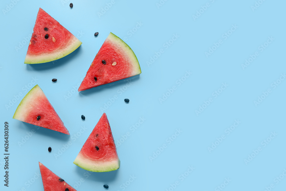 Composition with pieces of ripe watermelon on blue background