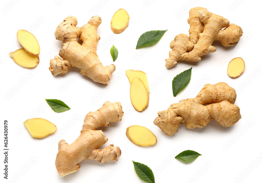 Fresh ginger roots and leaves on white background