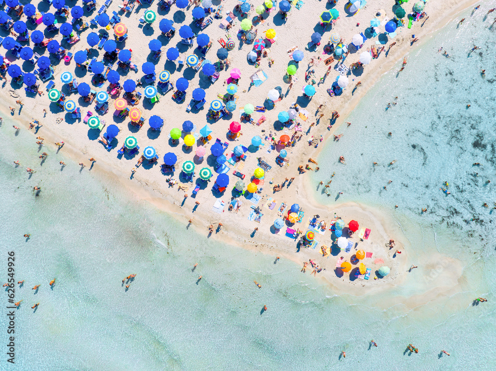 Aerial view on beach, people and umbrellas. Vacation and adventure. Europe, Mediterranean Sea. Top v