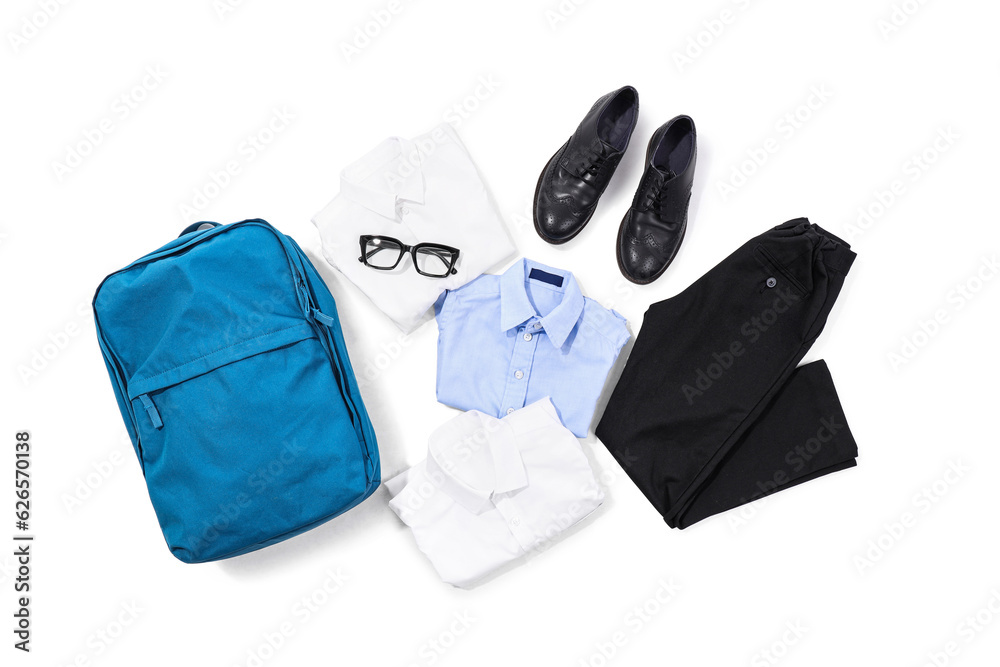 Composition with stylish school uniform, backpack, eyeglasses and shoes on white background