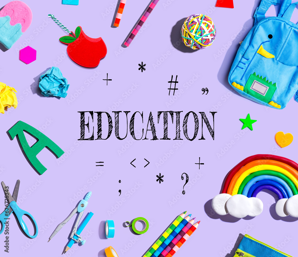 Education theme with school supplies on a purple background - flat lay