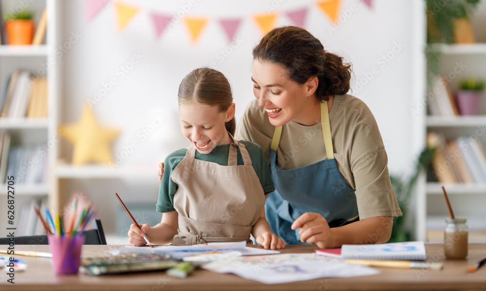 kid and teacher at the art class