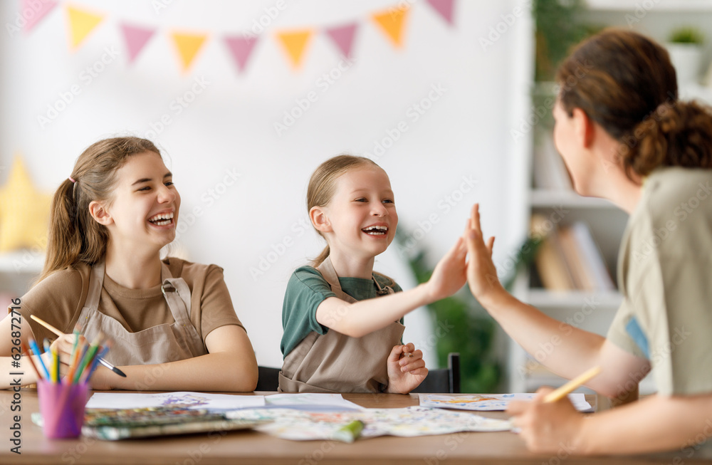 kids and teacher at the art class