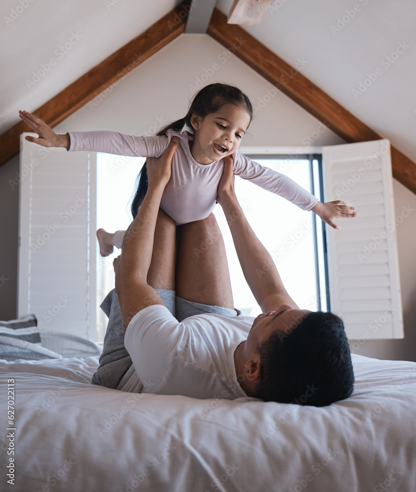 Airplane, game and child with father on a bed happy, playing and bonding in the morning together. Fl