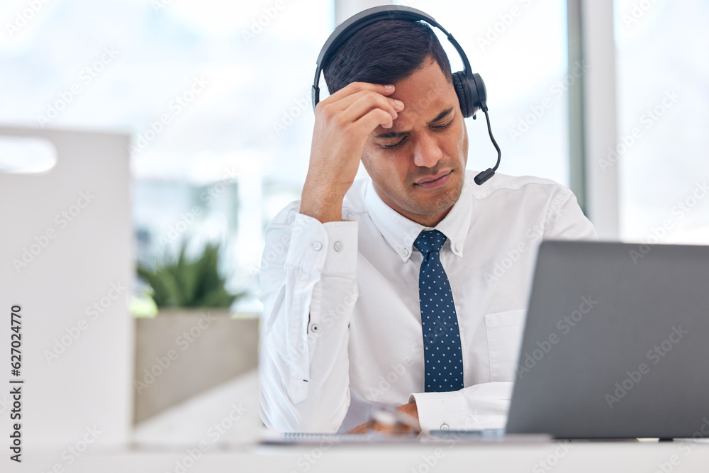 Call center, working and man with a headache or businessman in customer service with stress, burnout