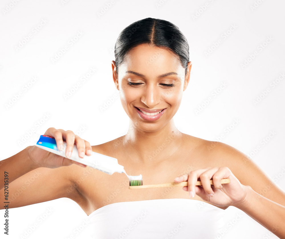 Happy woman, toothbrush and toothpaste for clean teeth, dental or hygiene against a white studio bac