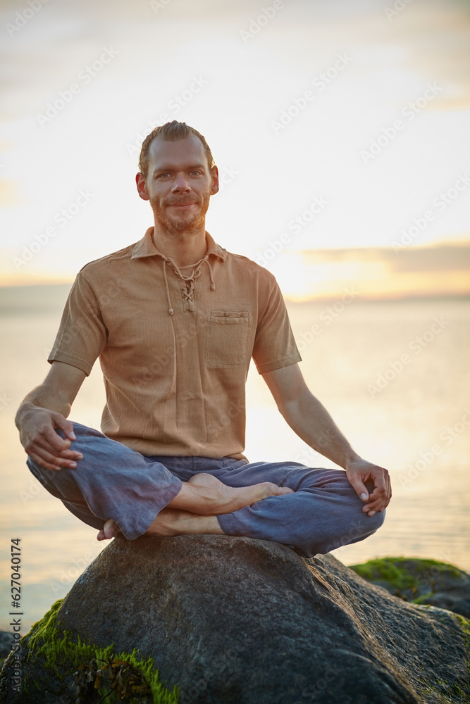 Happiness is right here, right now. Shot of a man sitting in the lotus position during his yoga rout