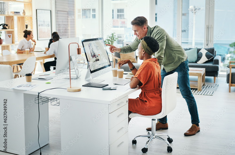 I think this one looks great. Full length shot of two young business colleagues working on a compute