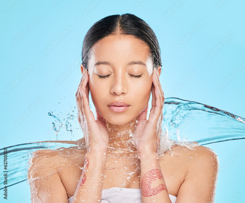 Skincare, beauty and face of woman with water on blue background for wellness, healthy skin and clea