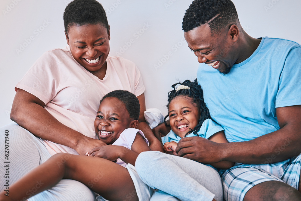 Happy, black family and tickle in a bed with smile, care and laugh on the weekend in their home. Bon