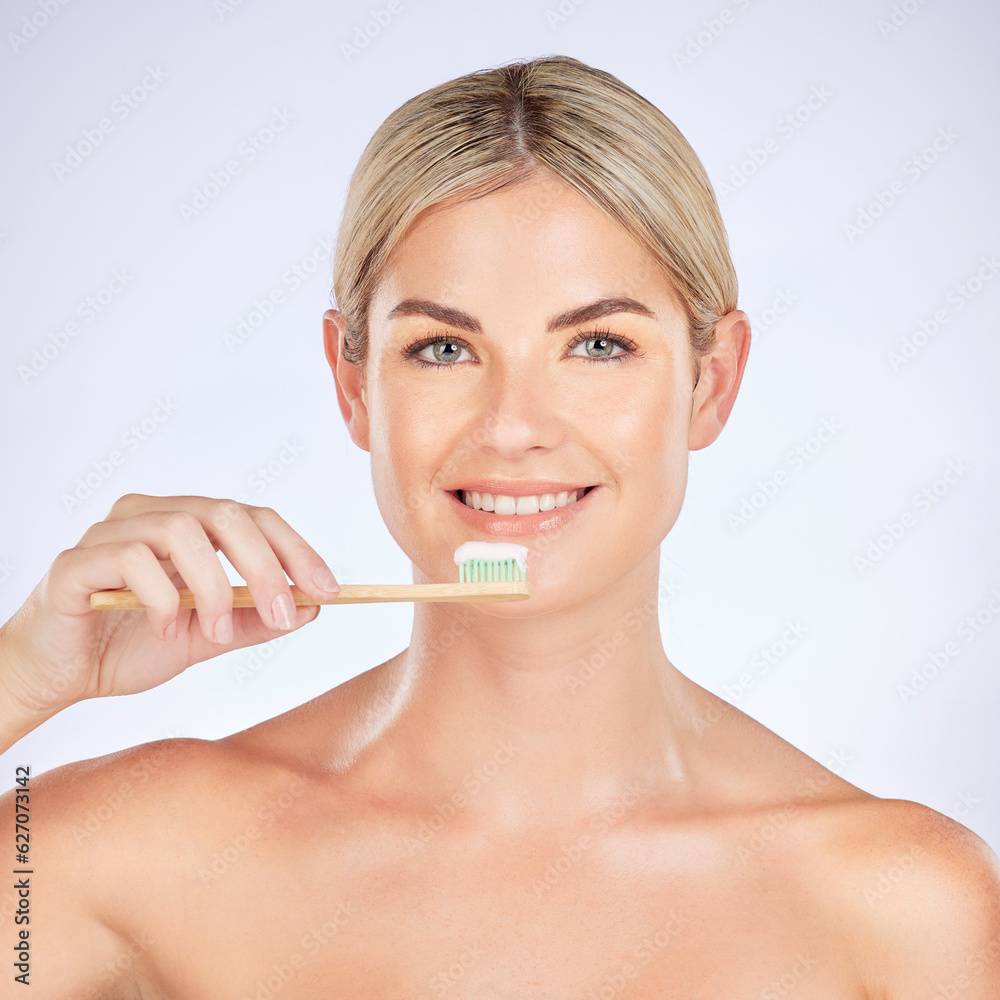 Portrait, woman and brushing teeth in studio for healthy dental wellness on background. Face of fema