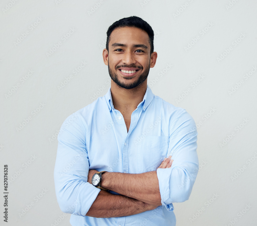 Economist, portrait and business man with arms crossed in studio isolated on a white background. Fac