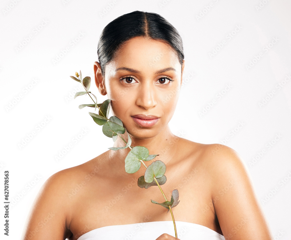 Woman, portrait and plant for natural beauty, skincare or nature cosmetics against a white studio ba