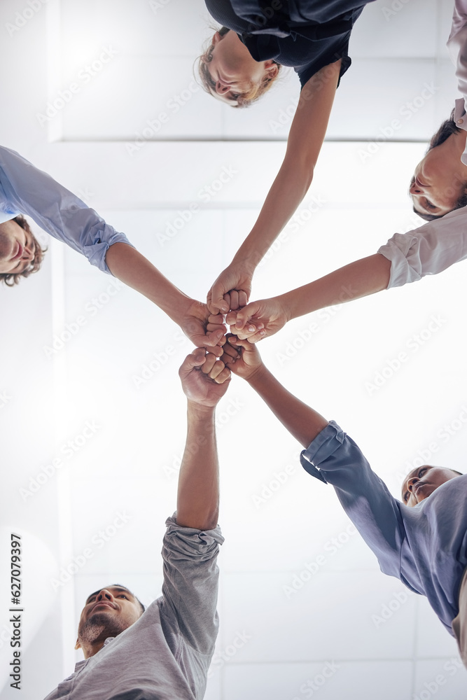 Circle, business people and fist bump for teamwork, below and motivation in workplace, diversity and