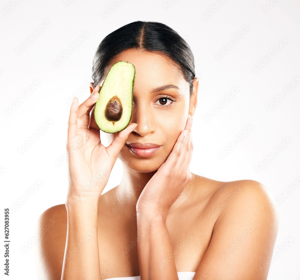 Woman, portrait and avocado in natural skincare, beauty or nutrition against a white studio backgrou