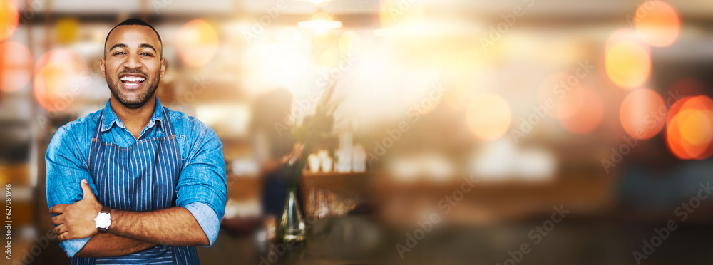 Black man, portrait and barista with arms crossed on bokeh and smile for small business at coffee sh