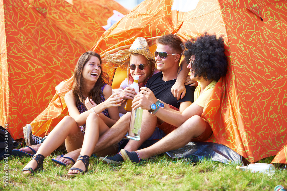 Friends forever. Shot of a group of friends by the campsite at an outdoor festival.