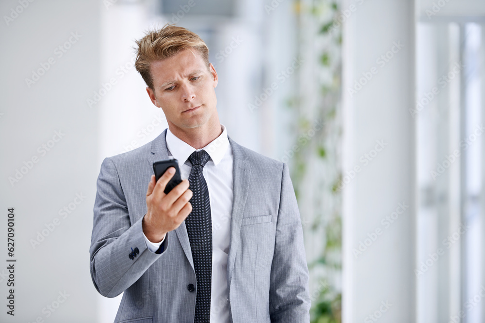 He has a drive for business. A young businessman standing in the workplace.