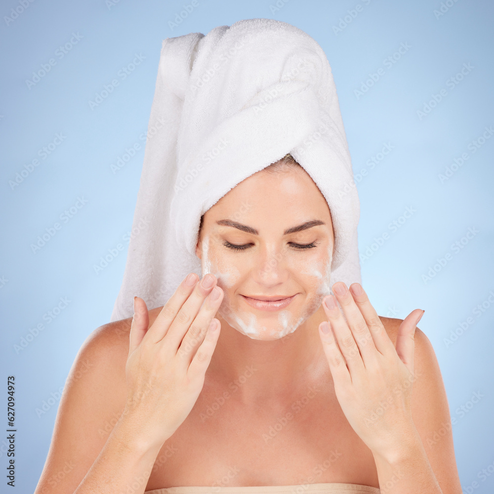 Shower, woman and washing face with foam in studio, blue background and cleaning cosmetics. Happy fe