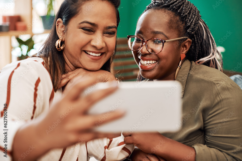 Live for the moments that make fun memories. Shot of two young women taking selfies at cafe.