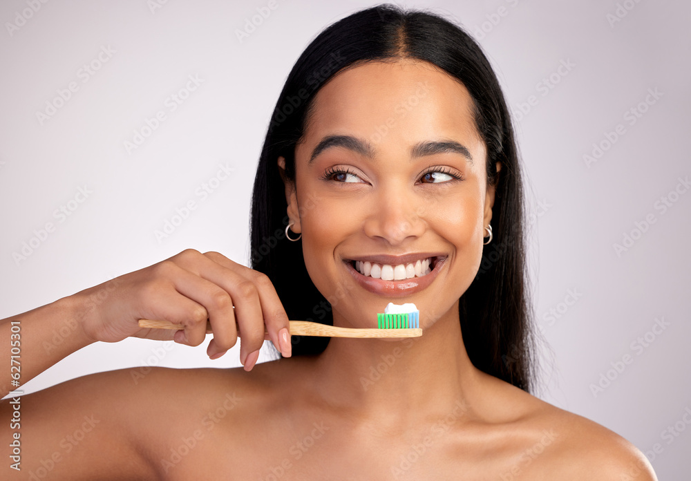 Happy woman, toothbrush and teeth for dental, cleaning or hygiene against a grey studio background. 