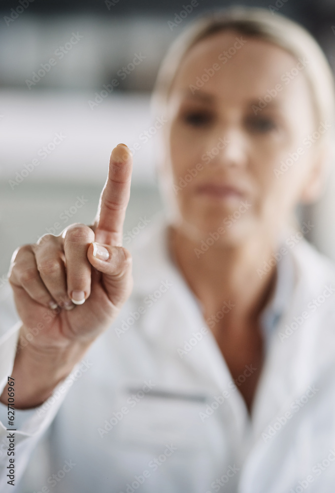 She pushes all the right buttons. Cropped shot of a mature female scientist working on touchscreen t