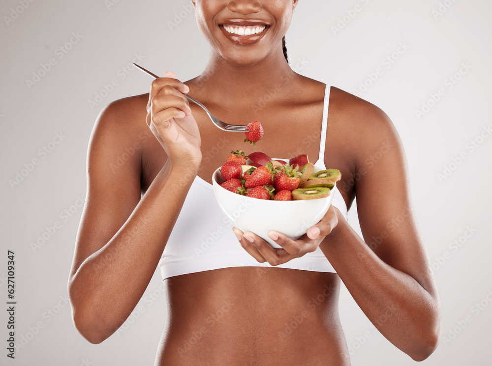 Woman, hands and diet with fruit salad for natural nutrition against a white studio background. Clos