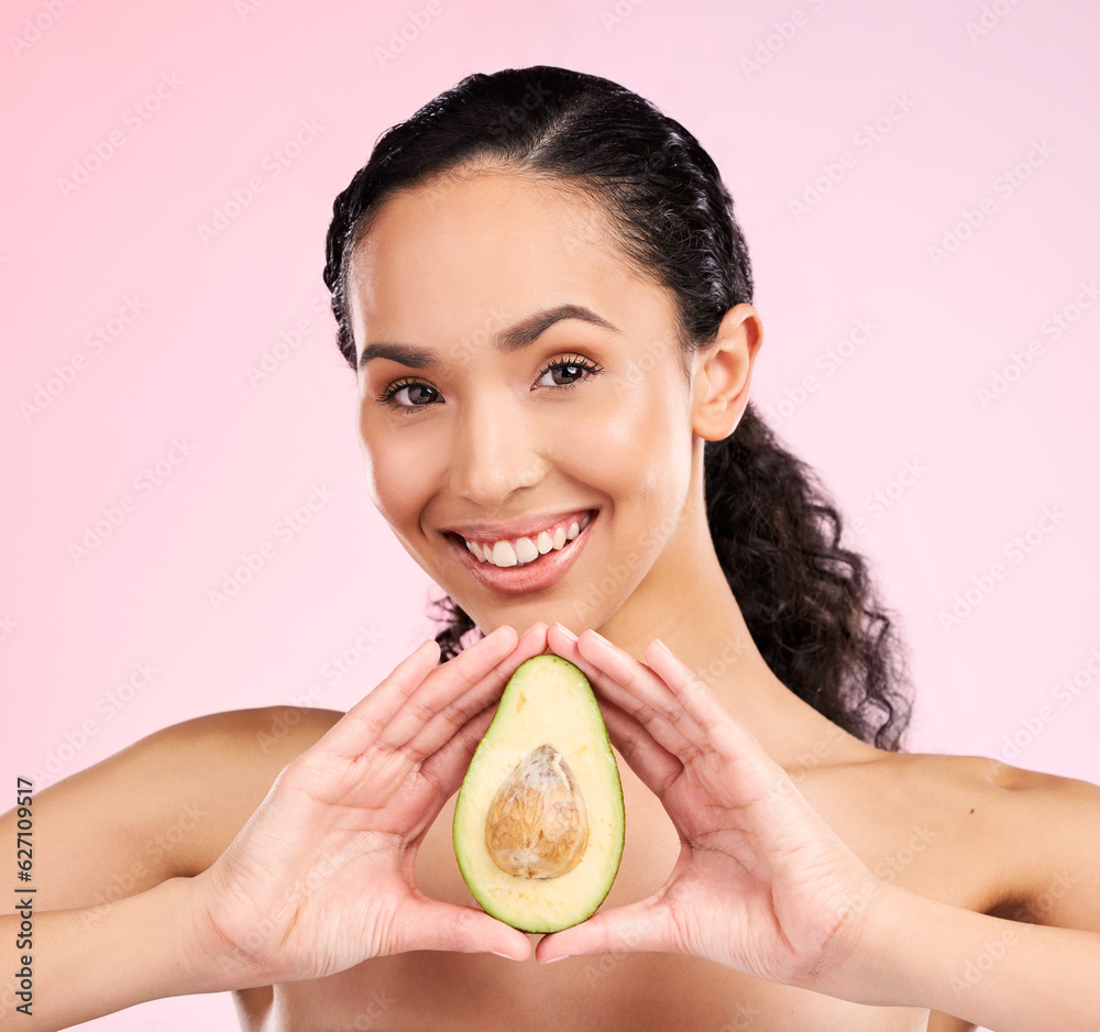 Face, skincare and happy woman with avocado in studio isolated on a pink background. Portrait, natur