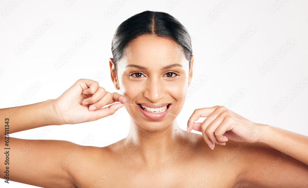 Happy woman, portrait and dental floss for teeth or clean hygiene against a white studio background.