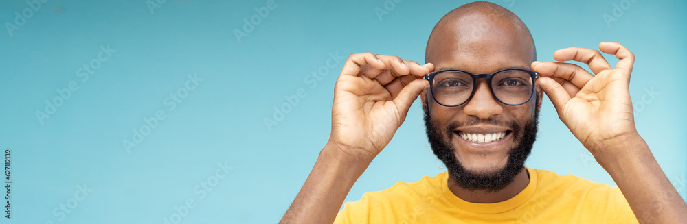 Black man, portrait or vision glasses on blue background, isolated mockup or wall mock up for eyes c