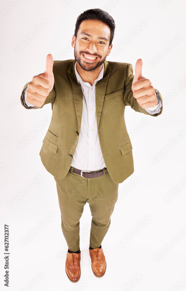 Thumbs up, portrait and happy business man in studio, white background and trust of success from abo