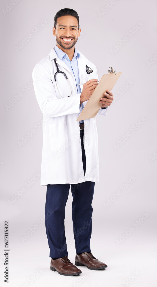 Happy asian man, portrait or doctor with clipboard in studio, planning notes or medical information.