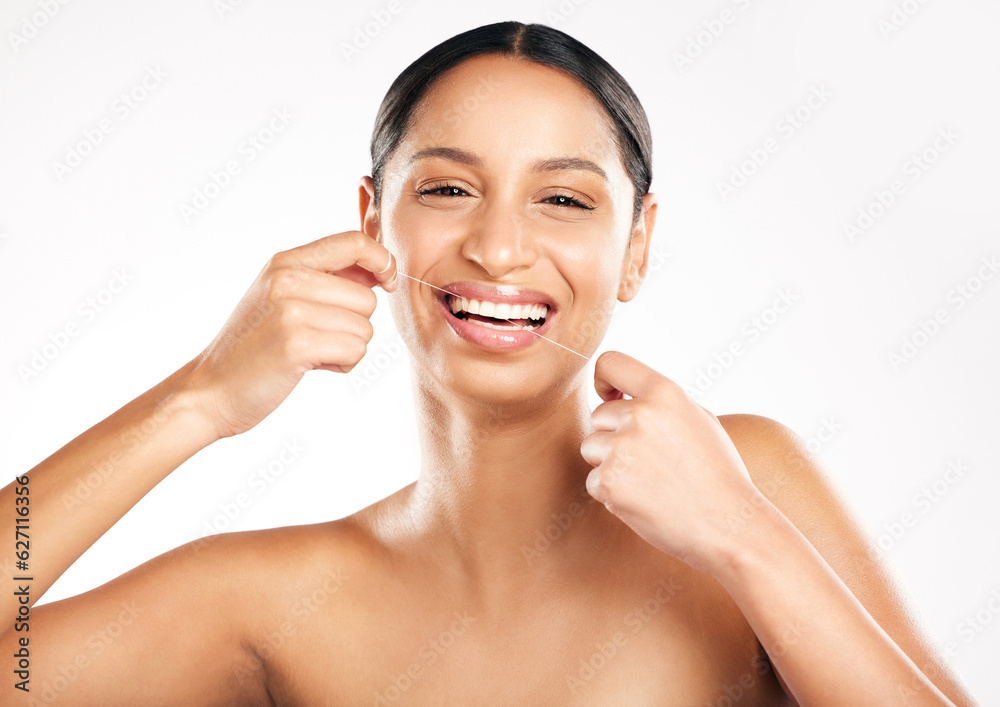 Happy woman, portrait and dental floss for teeth, hygiene or cleaning against a white studio backgro