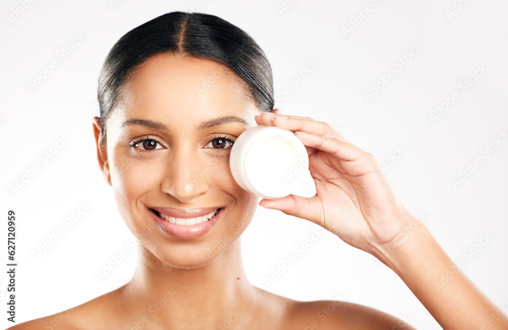 Happy woman, portrait and face cream for skincare, cosmetics or beauty against a white studio backgr