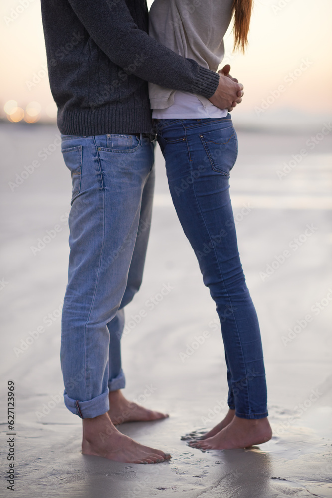 Love at the beach. A young couple enjoying each others company at the beach.