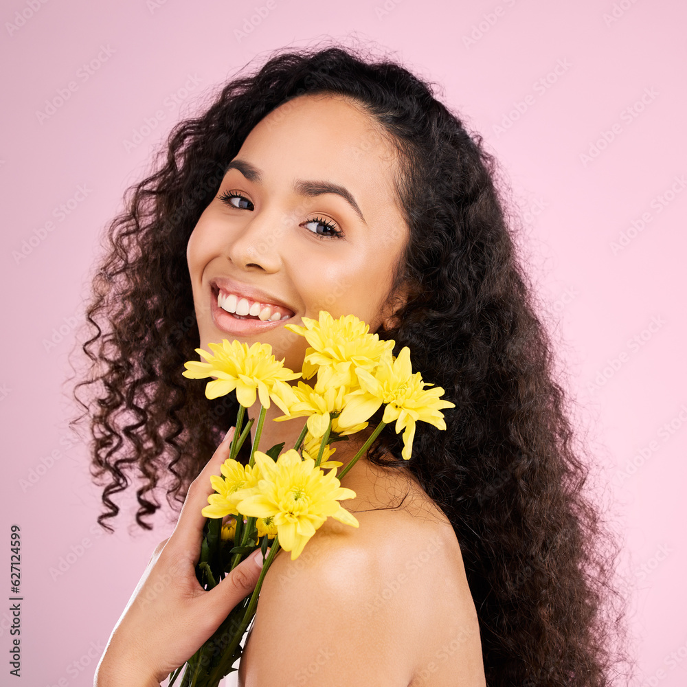 Skincare, face and beauty of woman with flowers in studio isolated on a pink background. Portrait, s