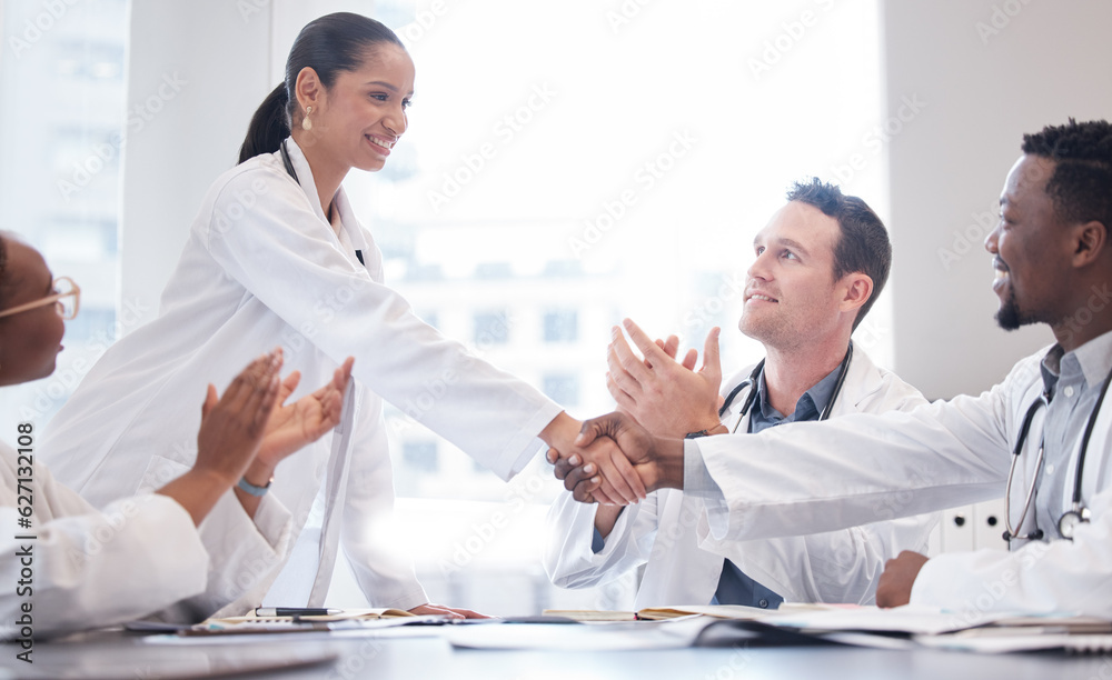 Doctors, staff and meeting with handshake, applause or promotion with healthcare innovation, growth 