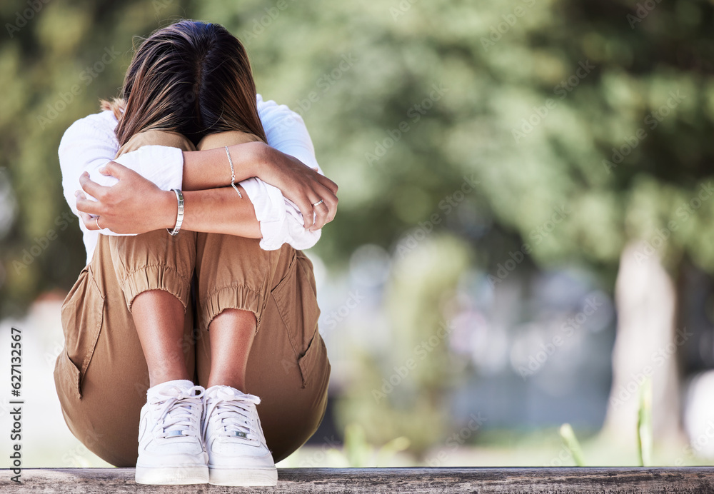 Sad, cry and student with woman in park for depression, frustrated and stress. Mental health, anxiet