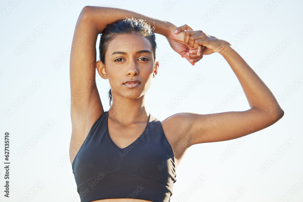 Woman stretching arms, fitness and portrait with sky, exercise outdoor in nature with focus and dete