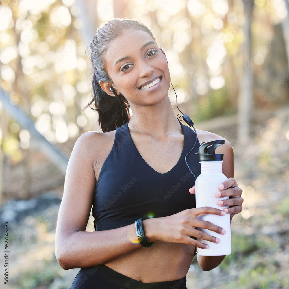 Fitness, portrait and woman with a bottle in the woods after running for race or marathon training. 