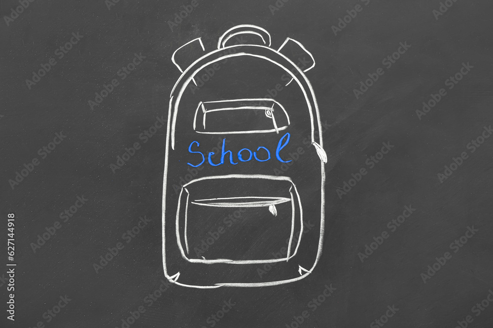 Drawn backpack and word SCHOOL on black chalkboard