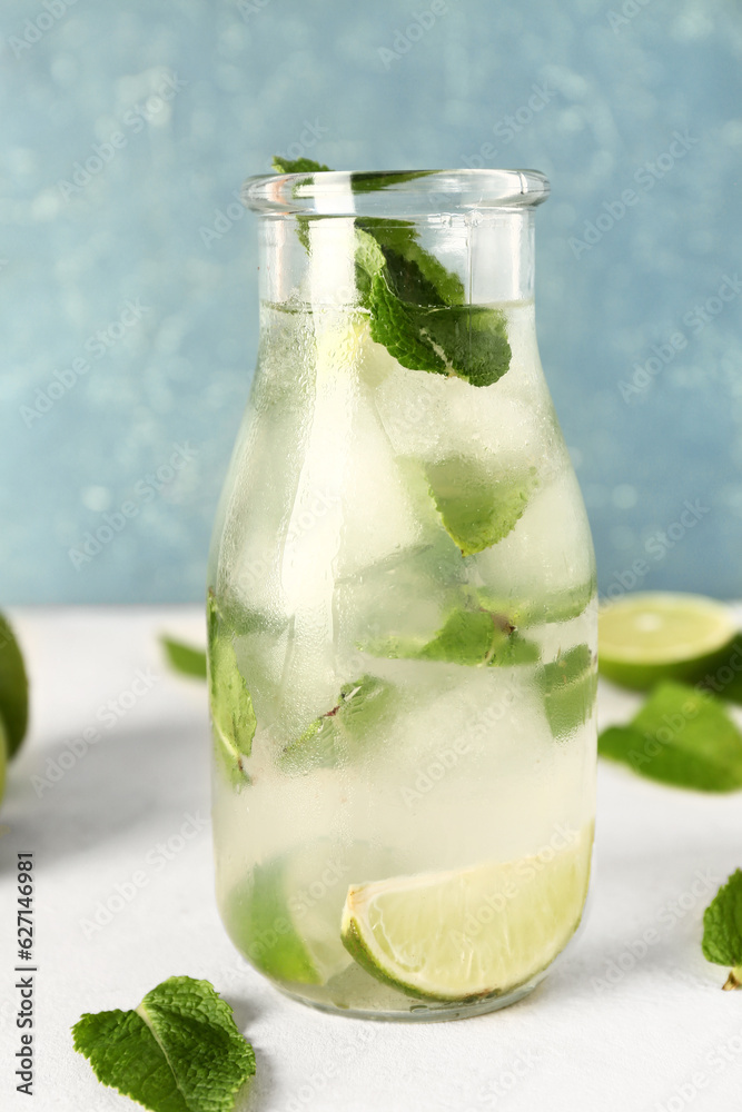 Bottle of cold mojito on light table